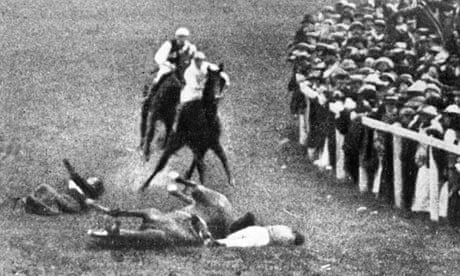 Emily Davison, left, and jockey Herbert Jones fall to the ground after her collision with the King's horse, Anmer. Photograph: Hulton Archive